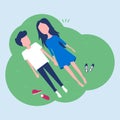 Happy young couple laying on green grass Royalty Free Stock Photo