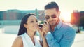 Happy young couple listening music in city by headphones outdoor Royalty Free Stock Photo