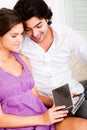 Happy young couple looking at cds Royalty Free Stock Photo