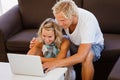 Happy young couple looking at laptop Royalty Free Stock Photo