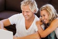 Happy young couple looking at laptop Royalty Free Stock Photo
