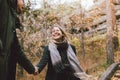 Happy young couple in love friends dressed in casual style walking together on nature park forest in cold season, family Royalty Free Stock Photo