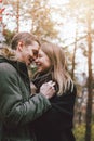 Happy young couple in love friends dressed in casual style walking together on nature park forest in cold season, family Royalty Free Stock Photo