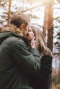 Happy young couple in love friends dressed in casual style walking together on nature park forest in cold season, family Royalty Free Stock Photo