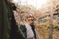 Happy young couple in love friends dressed in casual style walking together on nature park forest in cold season, family advenure Royalty Free Stock Photo