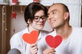 couple in love holding a red heart in their hands Royalty Free Stock Photo