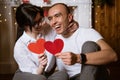 couple in love holding a red heart in their hands Royalty Free Stock Photo