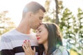 Happy young couple in love kissing. Park outdoors date. Loving couple Royalty Free Stock Photo