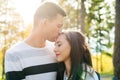 Happy young couple in love kissing. Park outdoors date. Loving couple Royalty Free Stock Photo