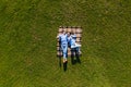 Happy young couple in love lying in the park together on blanket from above, Aerial view Royalty Free Stock Photo