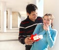 Happy young couple in love with present Royalty Free Stock Photo