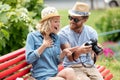 happy young couple in love sitting on park bench Royalty Free Stock Photo