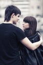 Happy young couple in love walking in city street Royalty Free Stock Photo