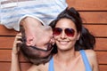 Happy young couple lying on a wooden floor Royalty Free Stock Photo