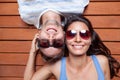 Happy young couple lying on a wooden floor Royalty Free Stock Photo