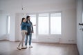 Young couple moving in new flat, new home and relocation concept.