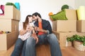 Happy young couple moving in new home first time - Man and woman having celebrating with champagne in new property house Royalty Free Stock Photo