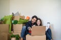 Happy young couple moving in new property house using laptop for shopping online Royalty Free Stock Photo