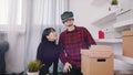 Happy young couple moving in toghether. Using VR goggles to view 3d interior design