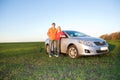 Happy young couple with new car Royalty Free Stock Photo