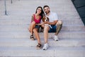 Happy young couple outdoors with beagle dog. Family and lifestyle concept Royalty Free Stock Photo