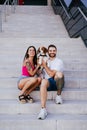 Happy young couple outdoors with beagle dog. Family and lifestyle concept Royalty Free Stock Photo