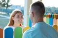 Happy young couple outdoors. Girl and boy looking at each other Royalty Free Stock Photo