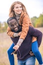 Happy young couple piggybacking Royalty Free Stock Photo