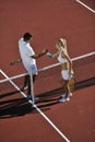 Happy young couple play tennis game outdoor