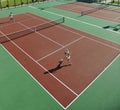 Happy young couple play tennis game outdoor