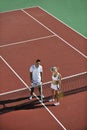 Happy young couple play tennis game outdoor
