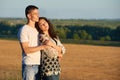 Happy young couple posing high on country outdoor, romantic people concept, summer season Royalty Free Stock Photo