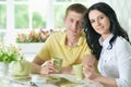 Portrait of young couple reading interesting book Royalty Free Stock Photo