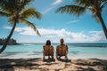 Happy young couple relaxing on beach chair at tropical sandy beach with coconut palm tree and beautiful blue sky. Summer vacation Royalty Free Stock Photo