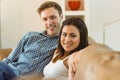 Happy young couple relaxing on the couch Royalty Free Stock Photo