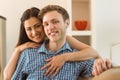 Happy young couple relaxing on the couch Royalty Free Stock Photo