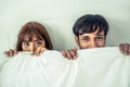 Happy young couple relaxing in the home bedroom. Royalty Free Stock Photo