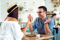 Happy couple at restaurant eating lunch, having fun Royalty Free Stock Photo