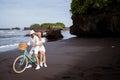 happy young couple riding bicycles on beach Royalty Free Stock Photo