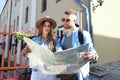 Happy young couple riding scooter in town. Handsome guy and young woman travel. Adventure and vacations concept. Royalty Free Stock Photo