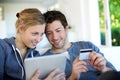 Happy young couple shopping with tablet Royalty Free Stock Photo