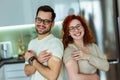 Young couple showing their arms after covid 19 vaccine with adhesive plasters Royalty Free Stock Photo