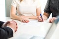 Happy young couple signing agreement or contract. Royalty Free Stock Photo