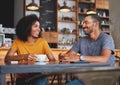 Happy young couple sitting in cafe