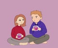 happy young couple sitting on the floor, looking at each other with a loving look, enjoying delicious tea on a pink background. Royalty Free Stock Photo