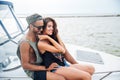 Happy young couple sitting on yacht Royalty Free Stock Photo