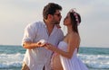 A happy young couple spend time at the beach