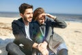 Happy young couple spending time on the sea shore in spring Royalty Free Stock Photo