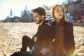 Happy young couple spending time on the sea shore in spring Royalty Free Stock Photo