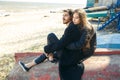 Happy young couple spending time on the sea shore in spring Royalty Free Stock Photo